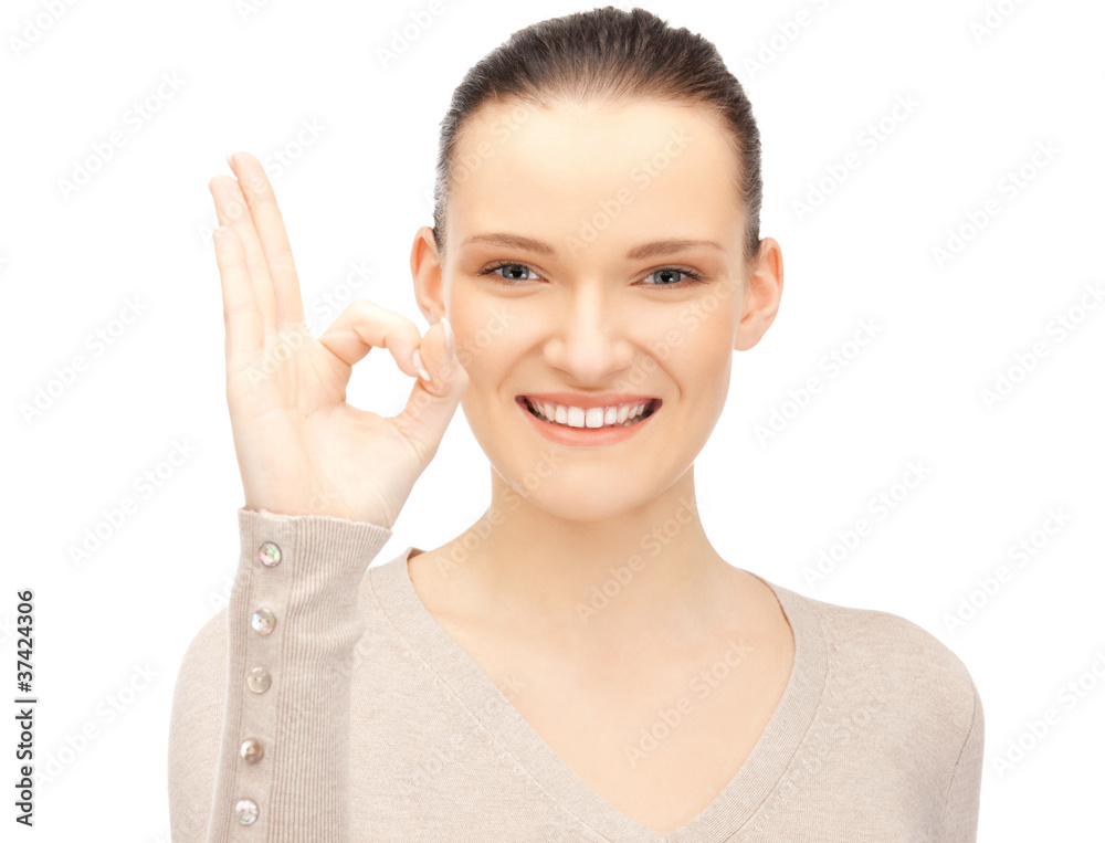 lovely teenage girl showing ok sign