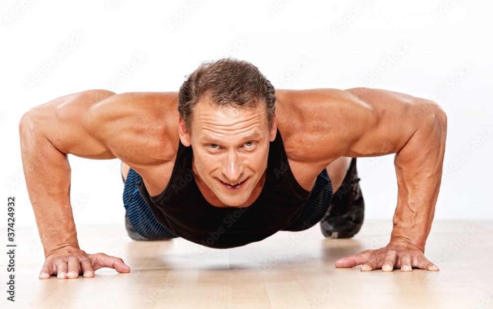 Handsome muscular man doing push-up Handsome muscular man doing push-up