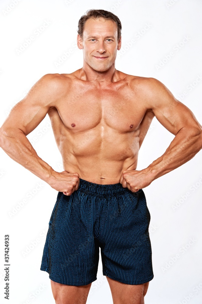 Fototapeta premium Handsome muscular man isolated on white