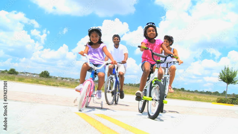 Healthy African American Family Cycling Together Healthy African American Family Cycling Together