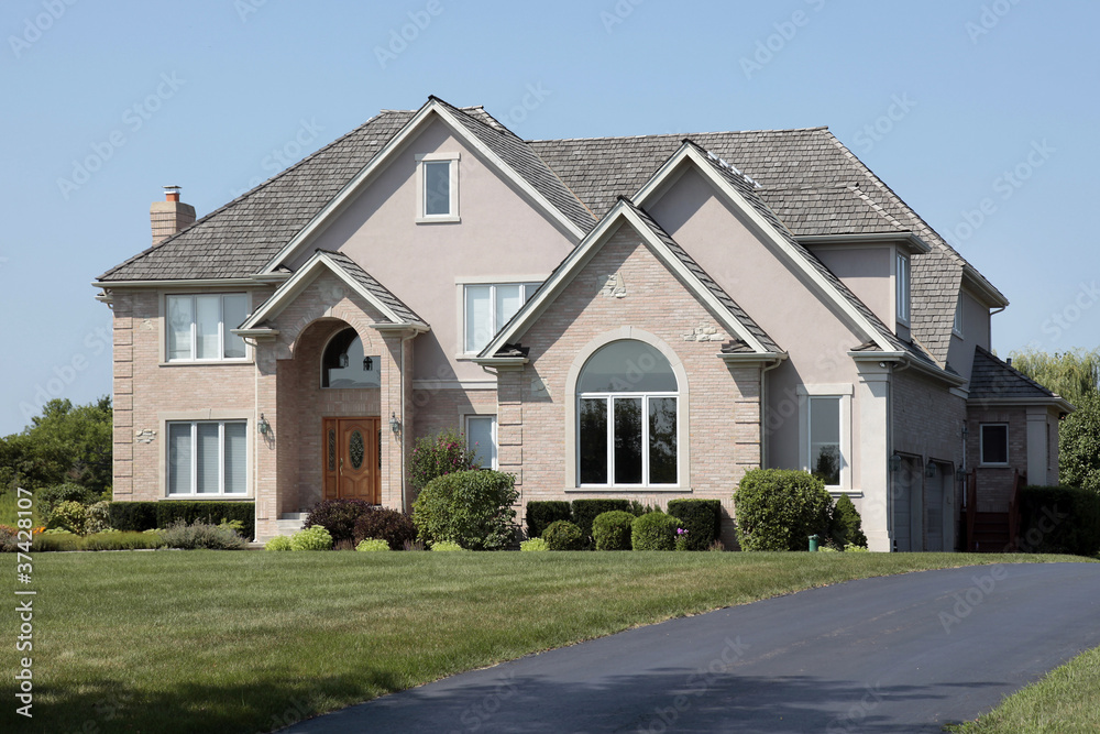 Brick home with arched entry