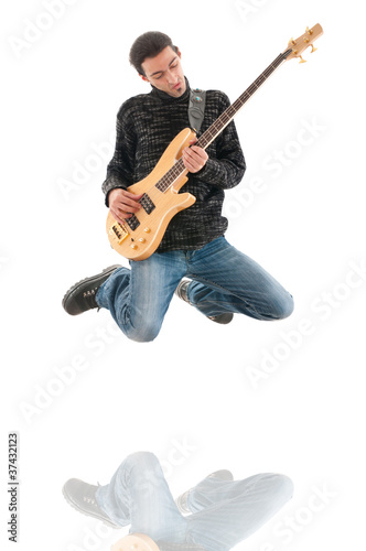 Guitar player jumping in the air
