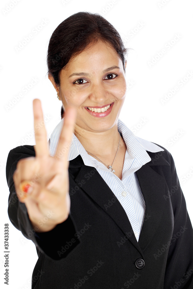 Happy business woman making the victory sign Happy business woman making the victory sign