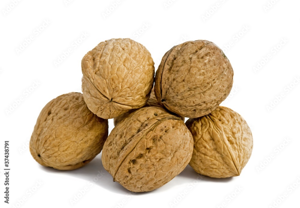 Few walnuts on the isolated white background Few walnuts on the isolated white background