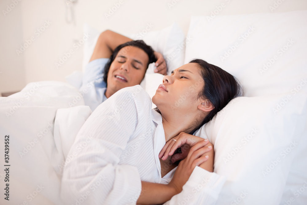 Woman being woken up by snoring boyfriend Woman being woken up by snoring boyfriend