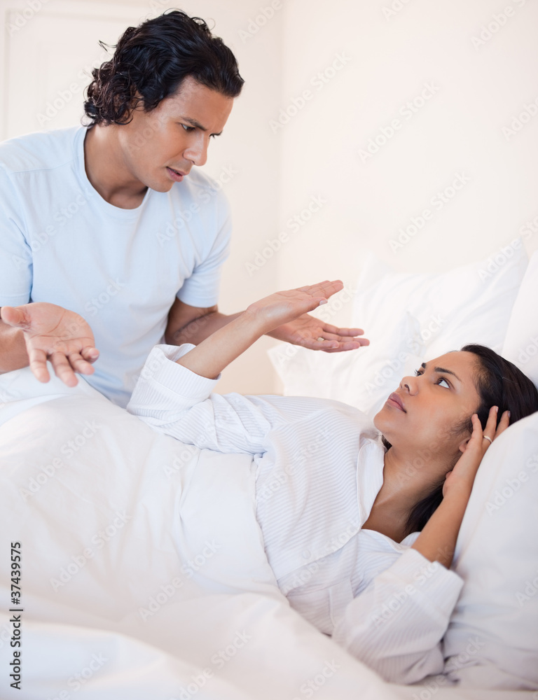 Couple arguing in the bedroom Couple arguing in the bedroom