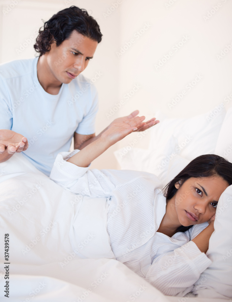 Couple having a dispute in the bedroom