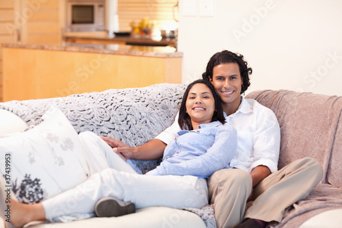 Cheerful couple on the couch together