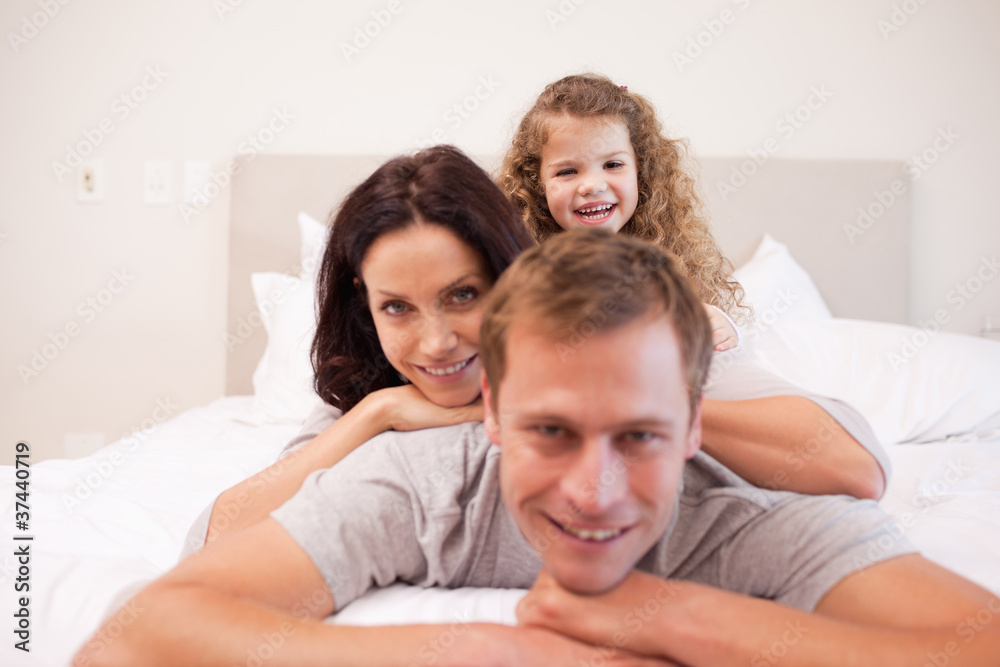 Playful family spending time in the bedroom Playful family spending time in the bedroom