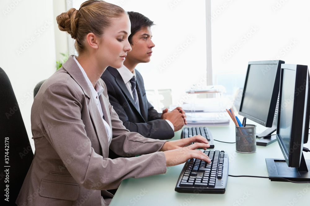 Business people working with computers Business people working with computers