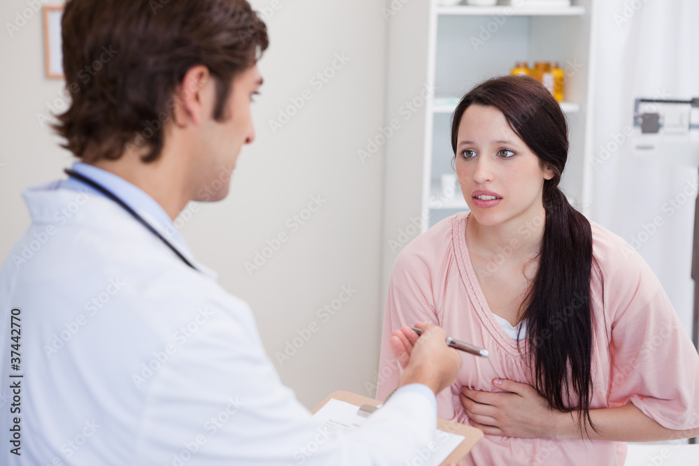 Doctor having serious conversation with patient