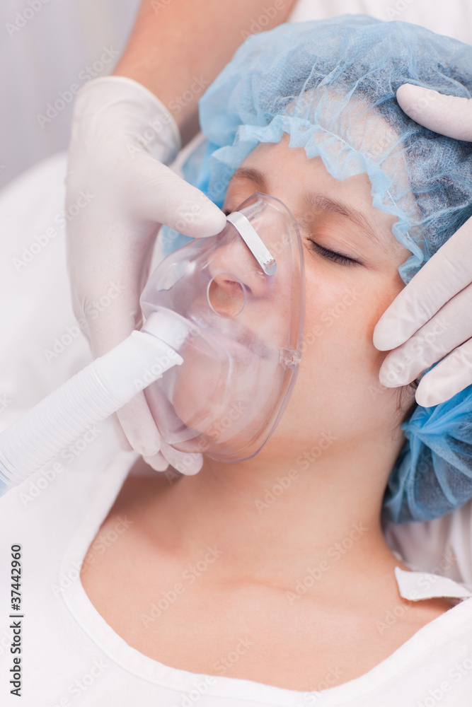 Female patient with oxygen mask
