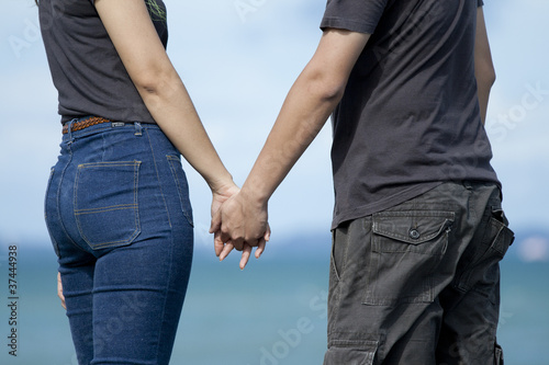 Young couple holding hands