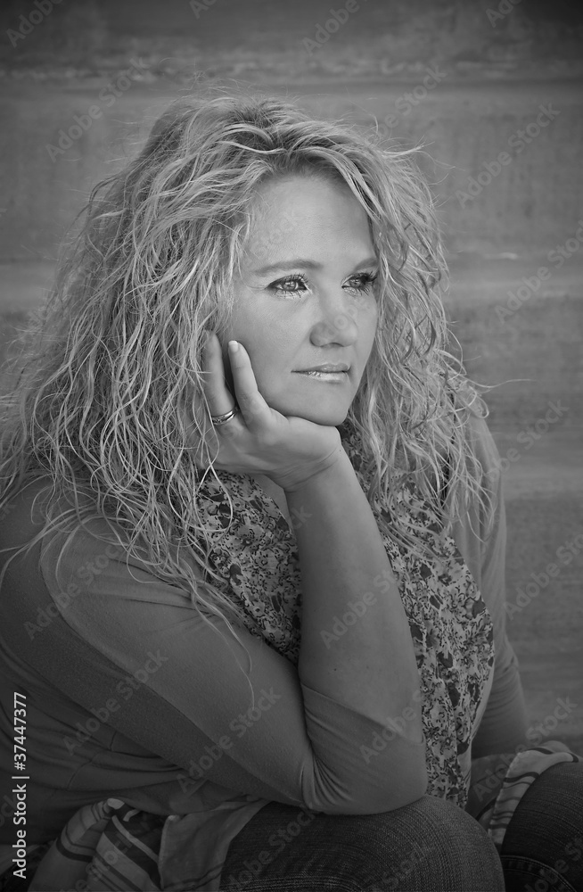 Pretty Mid Life Caucasian Woman on Stairs Black and White Pretty Mid Life Caucasian Woman on Stairs Black and White