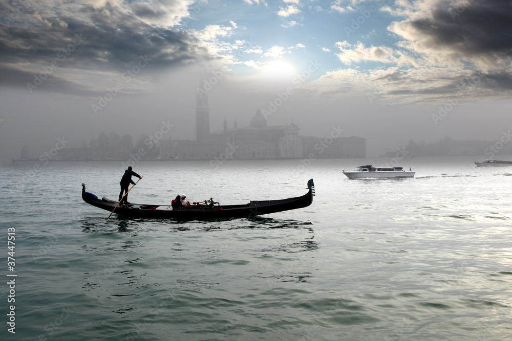 Naklejka premium Venice with gondola on canal in Italy