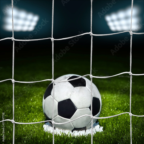 Soccer ball on the field of stadium with light © Vitaly Krivosheev