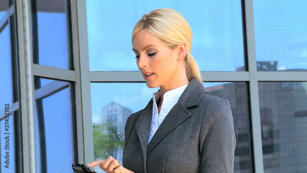 Female Business Executive with Smartphone in Close up Female Business Executive with Smartphone in Close up