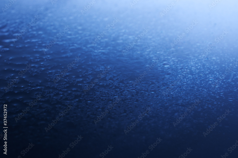 Spray water on a blue background