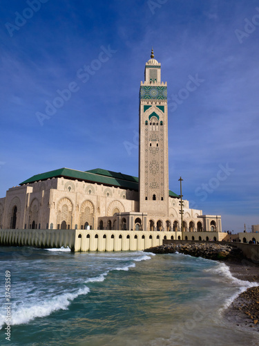 LPanorama of Ornate Hassan II Mosque against blue sky