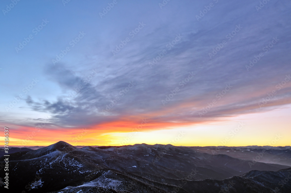 Mountain morning panorama with haze and burning sky