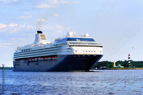 Fototapeta black cruise liner leaving the port of Riga