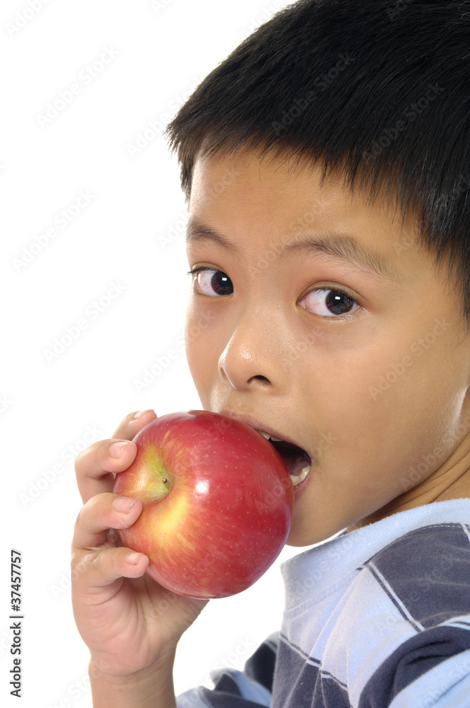 schoolboy with and apple looking at camera schoolboy with and apple looking at camera