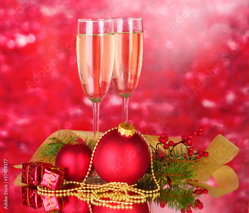 Two glasses with christmas decoration on red