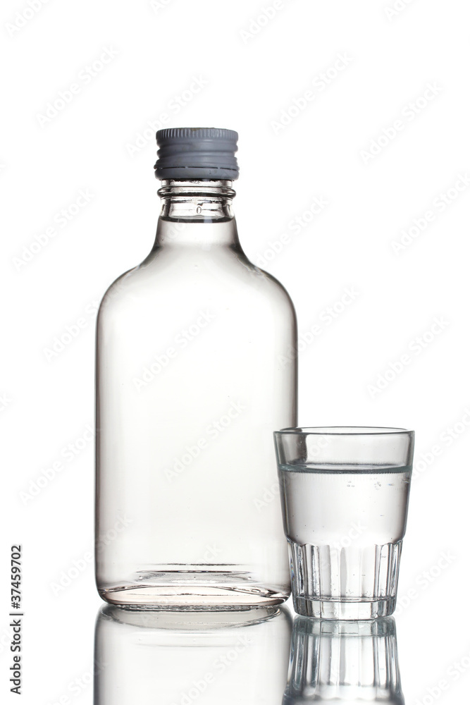 Bottle of vodka and wineglass isolated on white Bottle of vodka and wineglass isolated on white