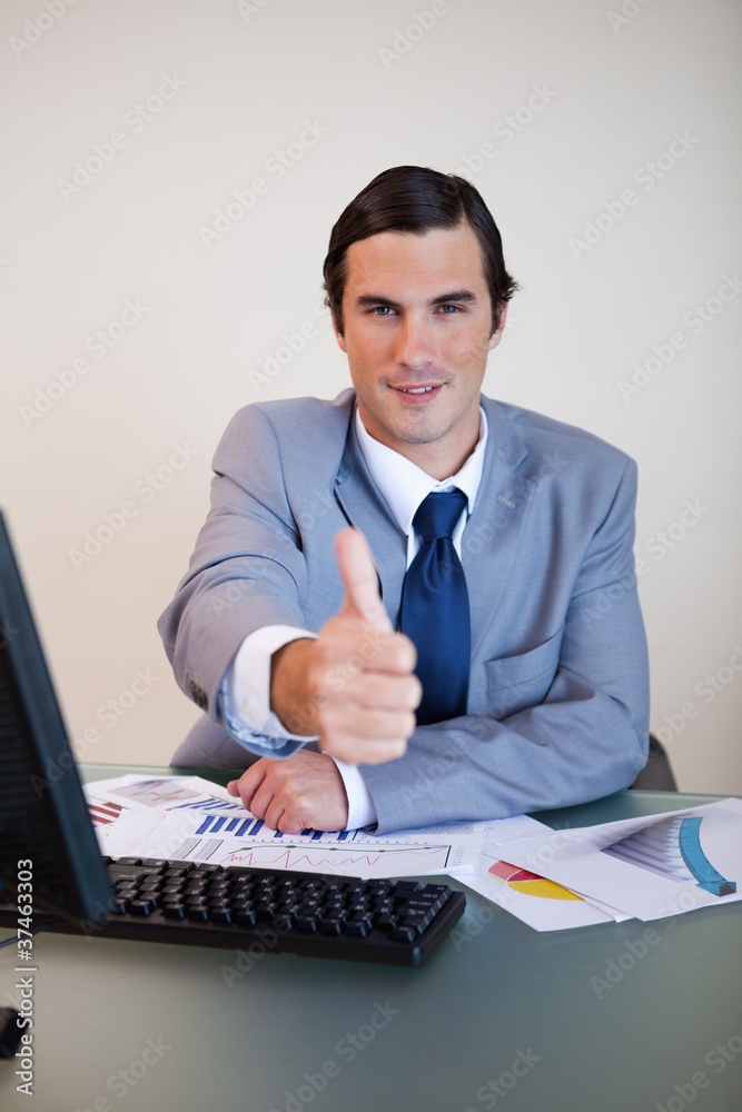 Businessman approves with thumb up Businessman approves with thumb up