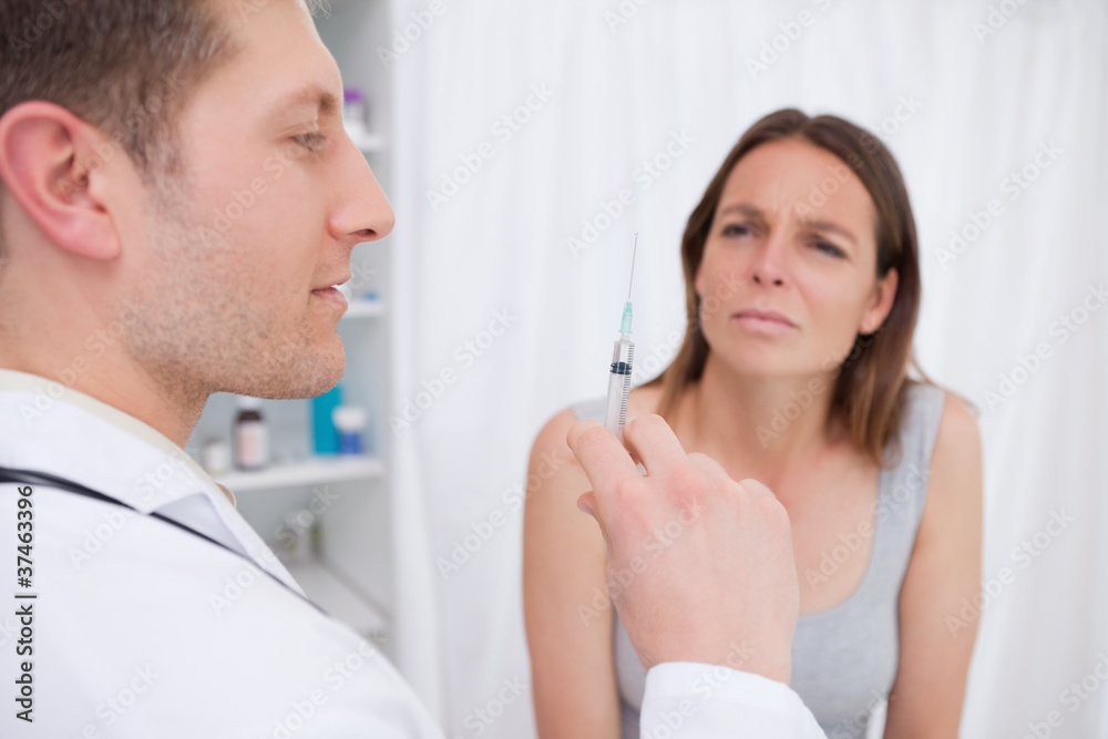 Doctor preparing injection Doctor preparing injection