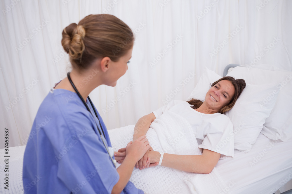 Fototapeta premium Surgeon visiting her patient