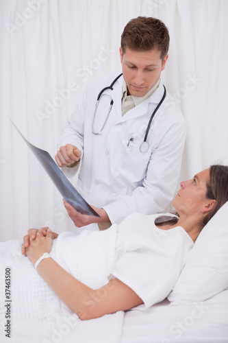 Doctor explaining x-ray to patient
