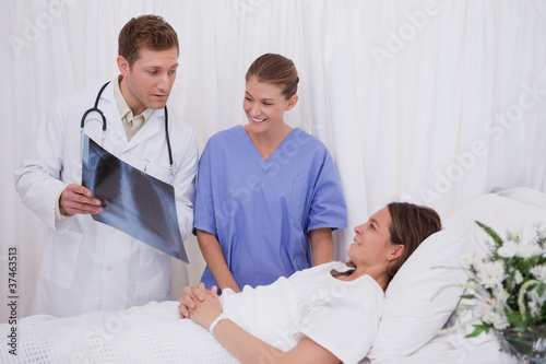 Doctors explaining x-ray to patient