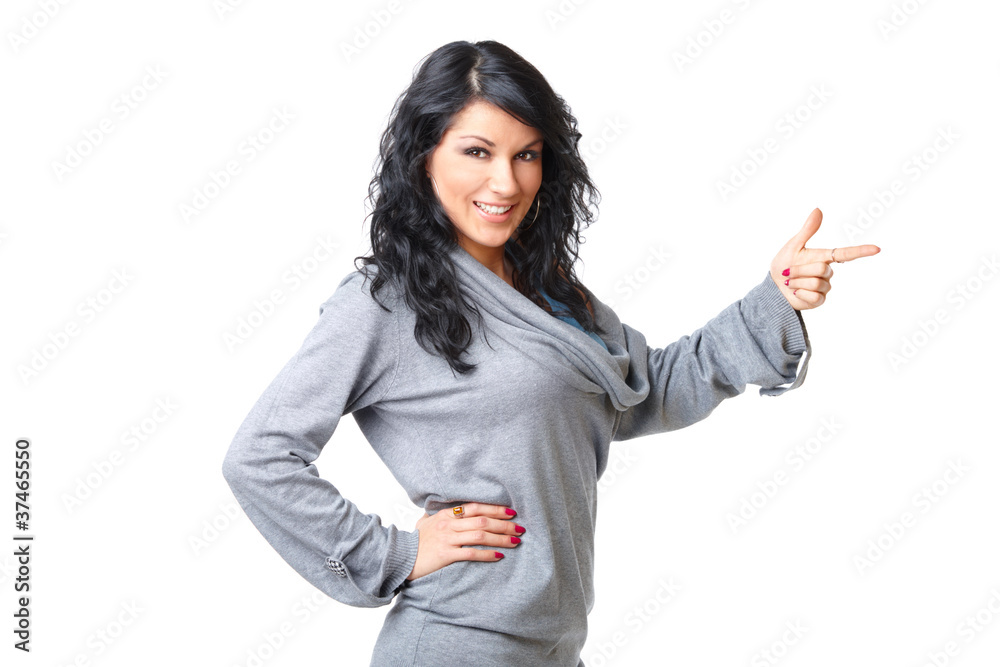 Beautiful young woman standing and pointing Beautiful young woman standing and pointing