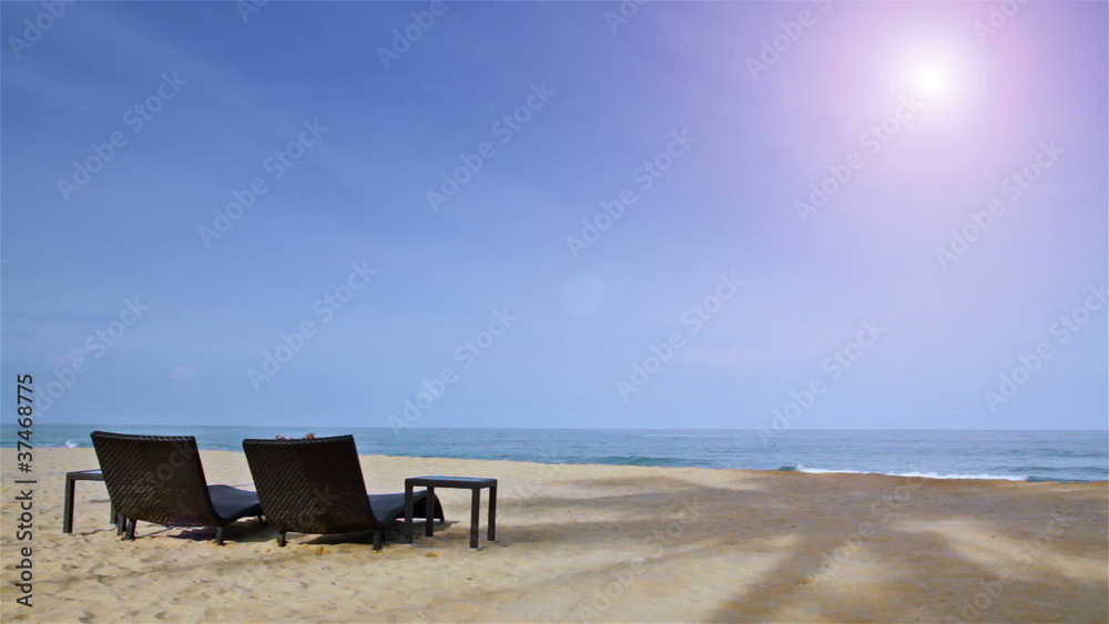 Beach chairs on sand overlooking the sea Beach chairs on sand overlooking the sea