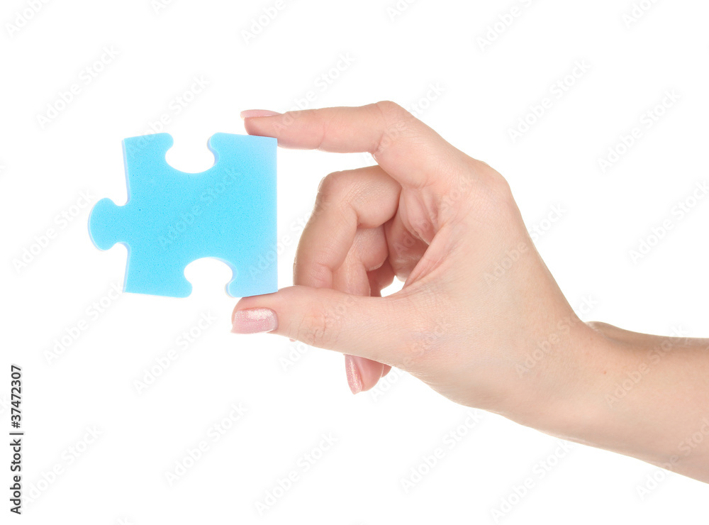 Blue puzzle with a hand isolated on white Blue puzzle with a hand isolated on white