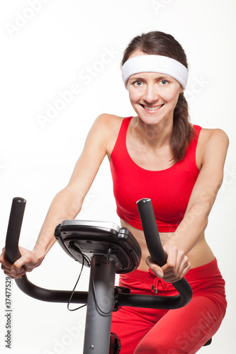 Young woman on a training bicycle