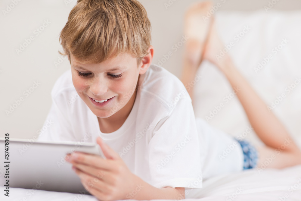 Young boy using a tablet computer Young boy using a tablet computer