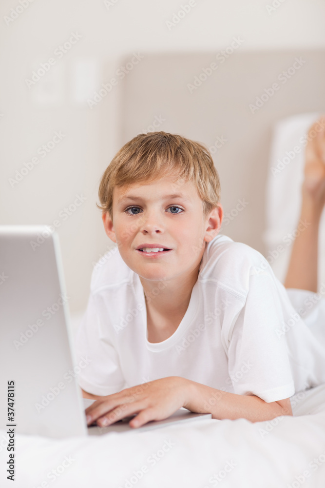 Portrait of a boy using a laptop Portrait of a boy using a laptop