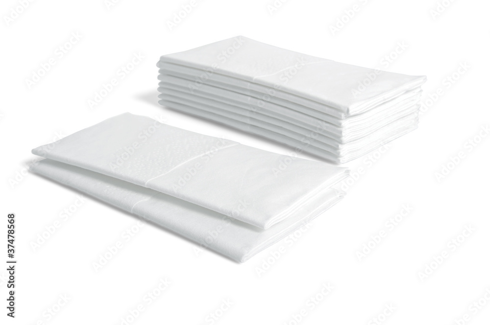 Stacks of folded disposable tissue papers on white background