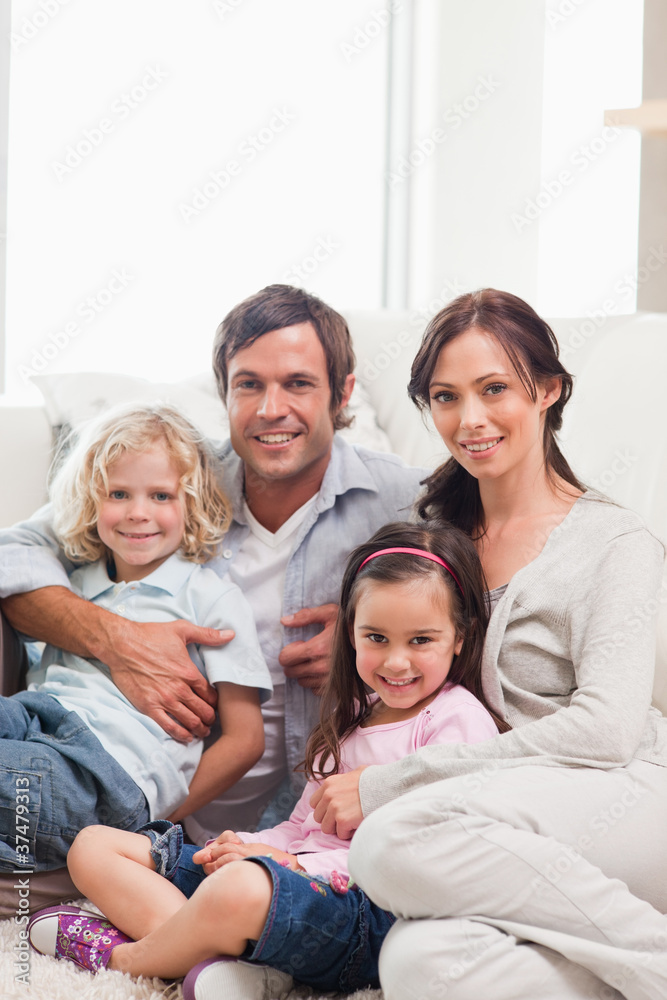 Portrait of a family relaxing on a sofa