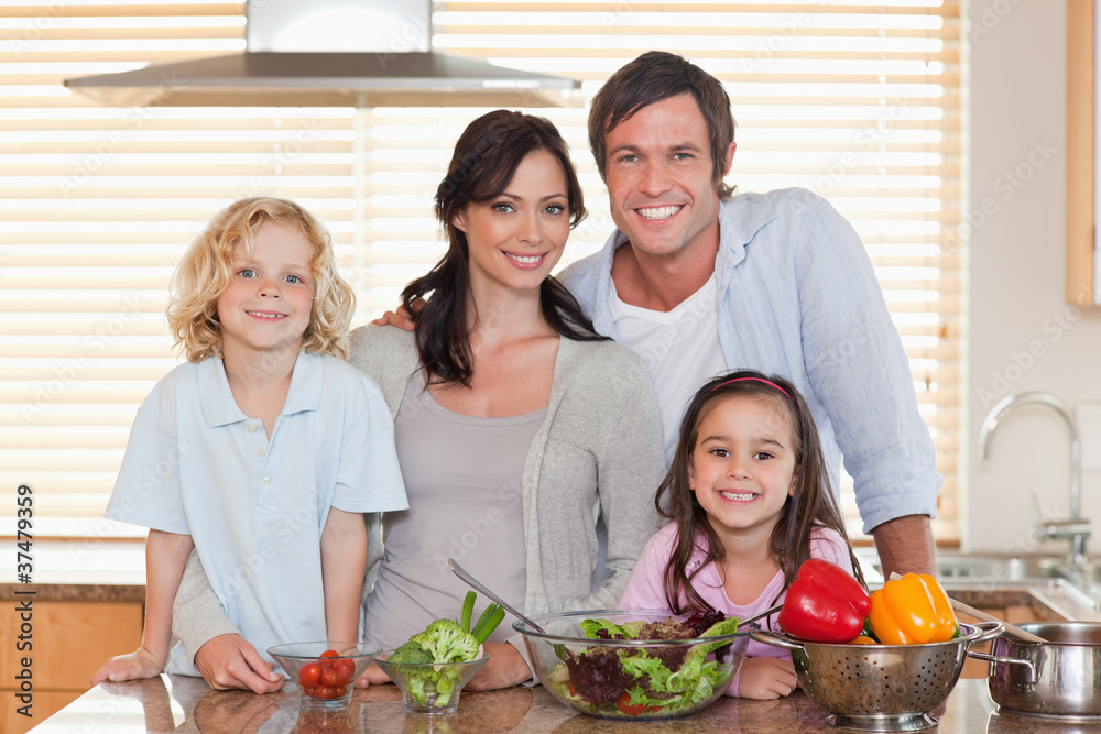 Family preparing a salad together