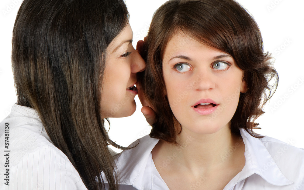 Two young happy women talk