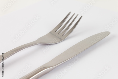 Fork and knife on gray background