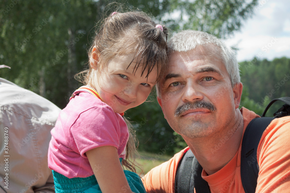 Grandfather and granddaughter out for a walk