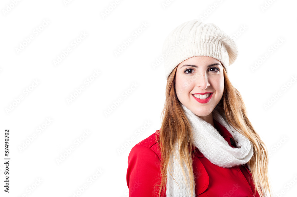 Smiling young girl with white hat and scarf looking at camera Smiling young girl with white hat and scarf looking at camera