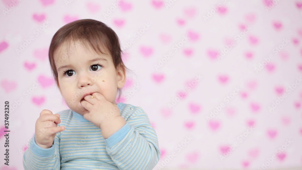 Closeup portrait of a baby boy a cookie