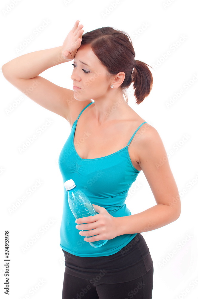 Thirsty young women drinking water after fitness workout. Isolat Thirsty young women drinking water after fitness workout. Isolat