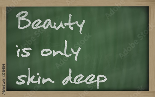 " Beauty is only skin deep " written on a blackboard