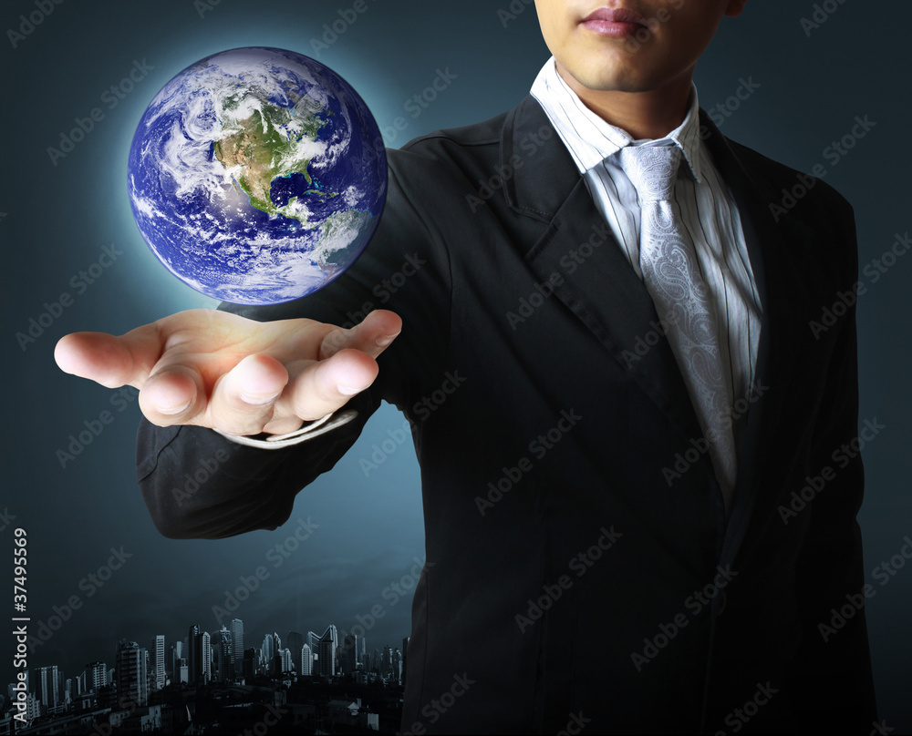 holding a glowing earth globe in his hand holding a glowing earth globe in his hand